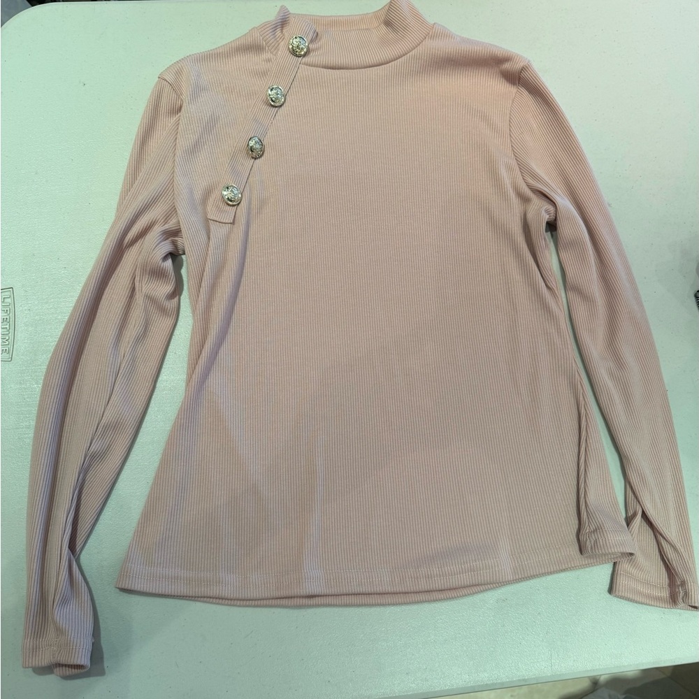 Pink turtle neck with a silver button detail